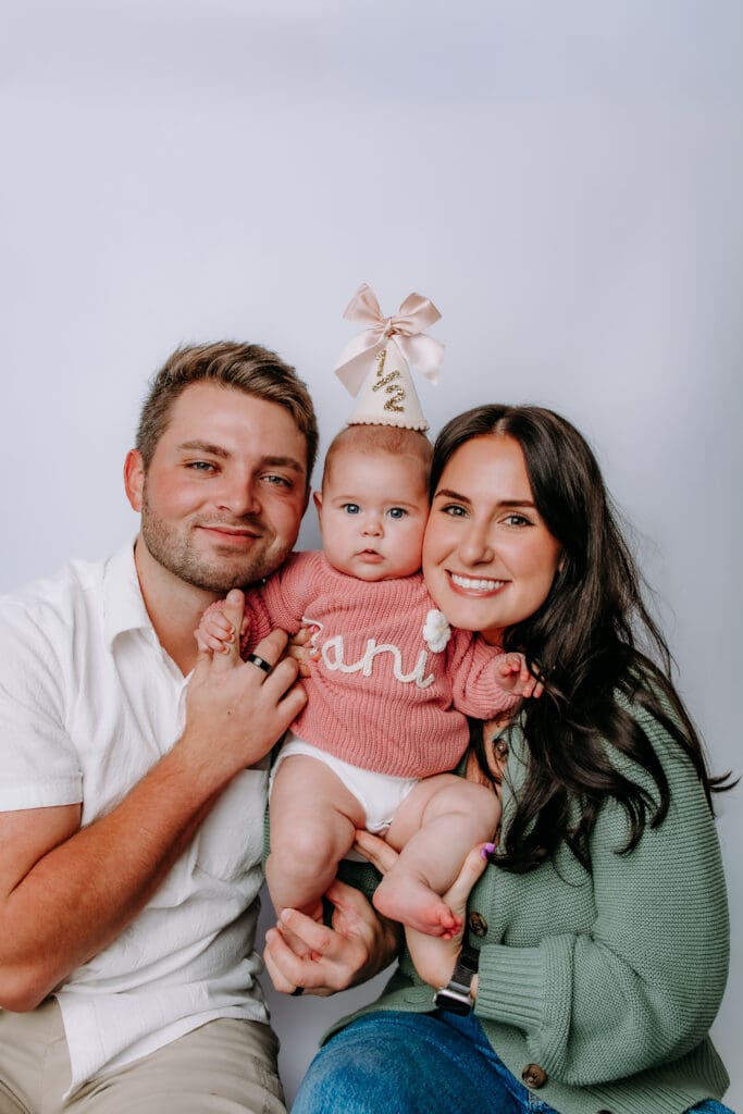 6 month baby with parents and studio backdrop for Lebanon, TN milestone photoshoot