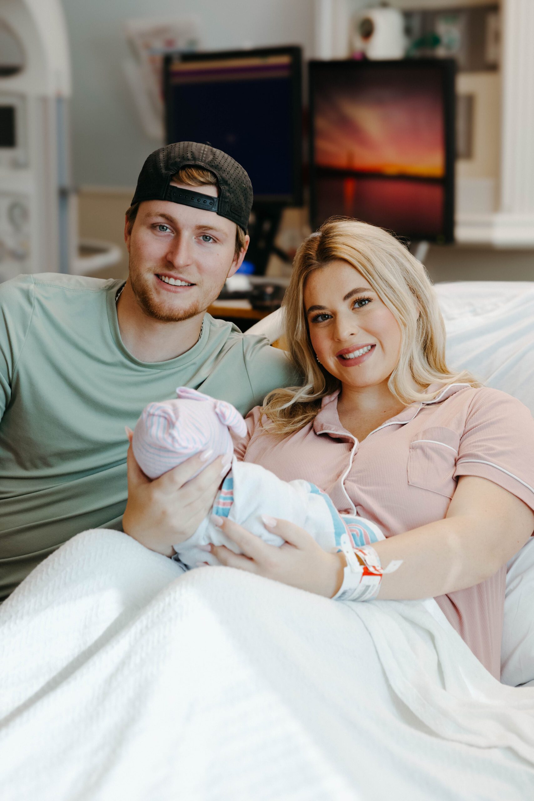 mom and dad in Nashville hospital with newborn baby during fresh 48 session